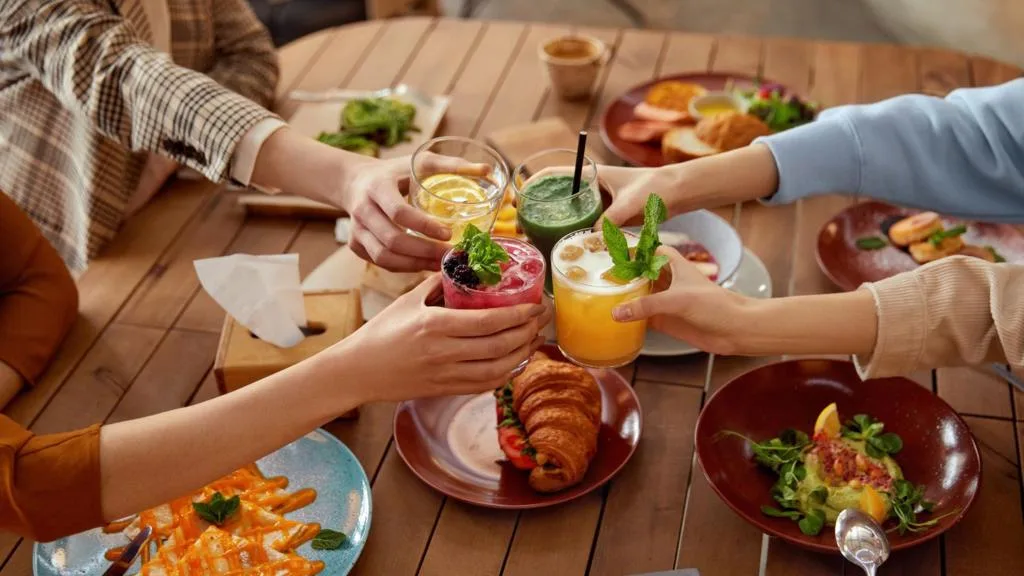 People dining at a restaurant with menus and drinks