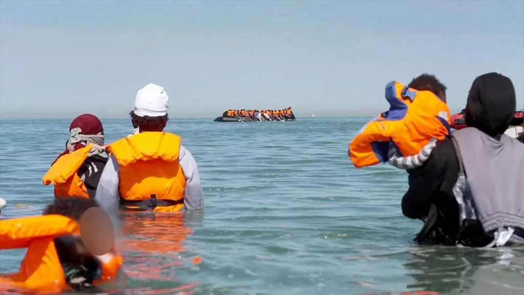 Inflatable boat carrying migrants during a Channel crossing