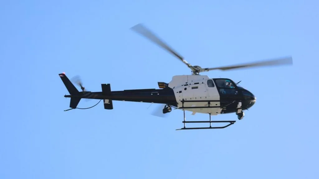 Police and emergency crews at the site of a helicopter crash near Montreal