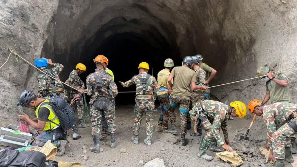 Rescue workers search flooded tunnels near the Trishuli River in Nepal