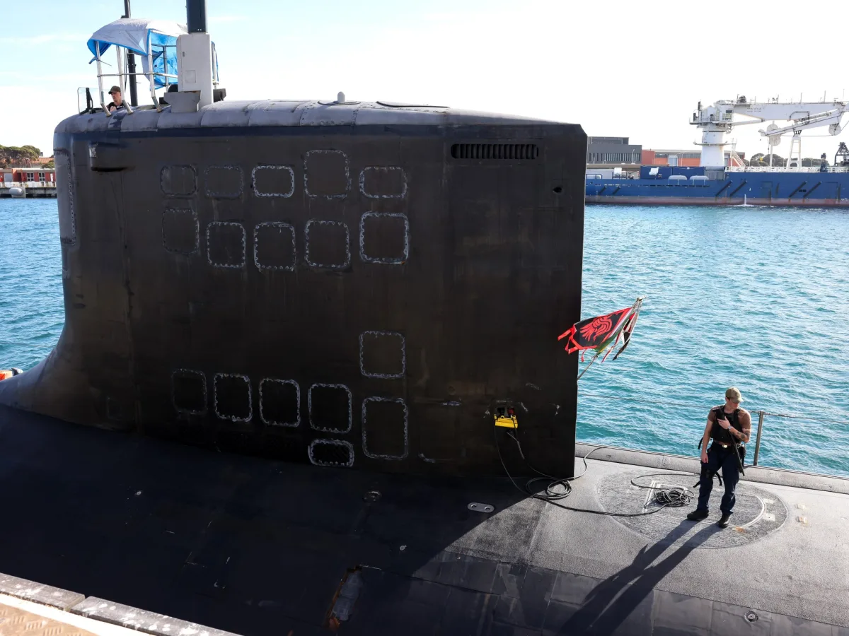 Anduril logo with a Navy submarine in the background