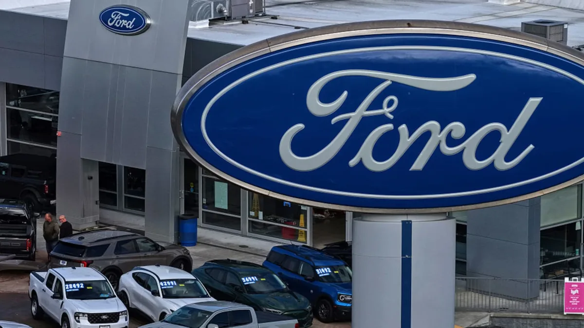 Ford and Hyundai logos during a U.S. auto sales comparison