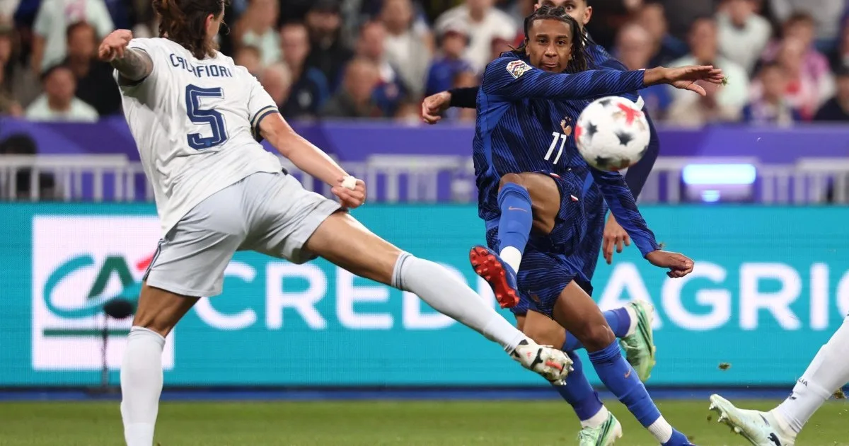Michael Olise takes a free kick for France against Italy at the Stade de France