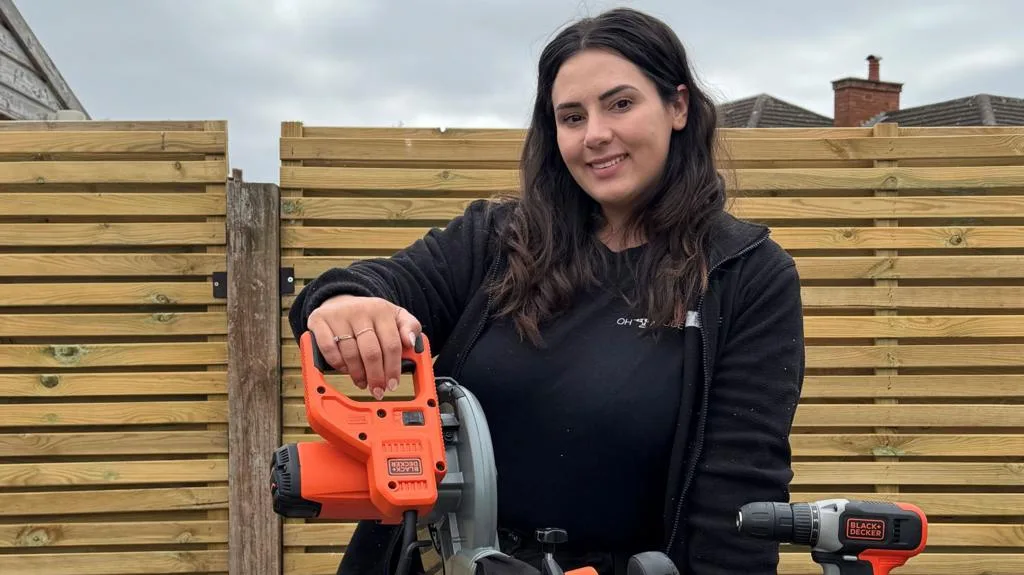 A woman carrying out a DIY home renovation project in the UK