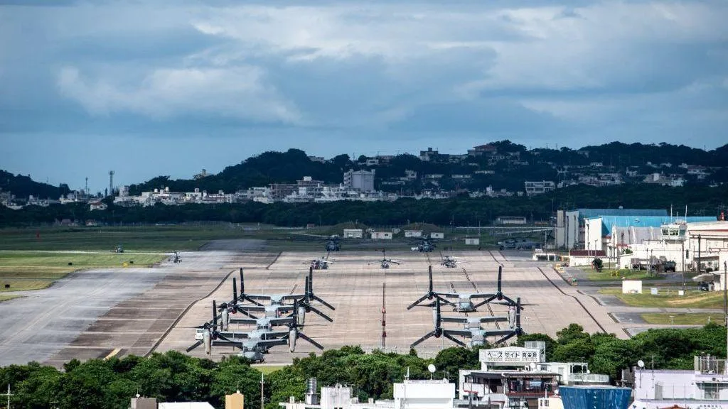 Police and officials in Okinawa following the hotel death investigation