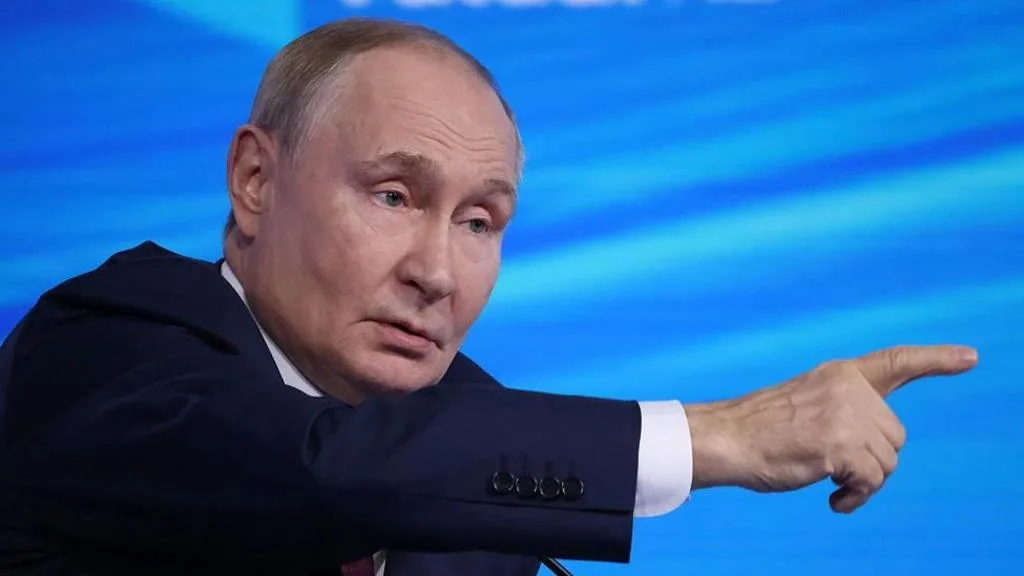 Vladimir Putin and Kremlin backdrop in Moscow