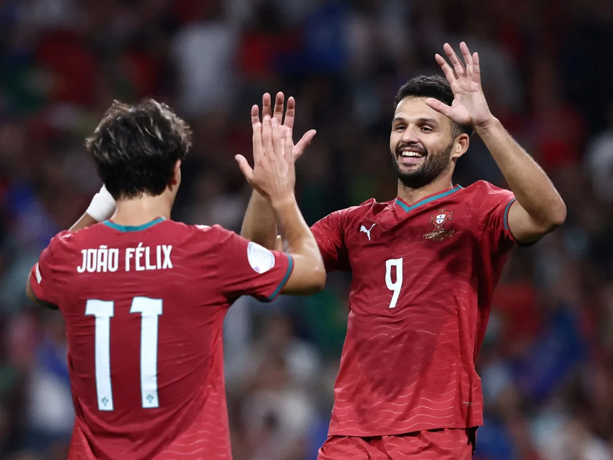 Portugal players celebrate after coming from behind to beat Norway in Porto