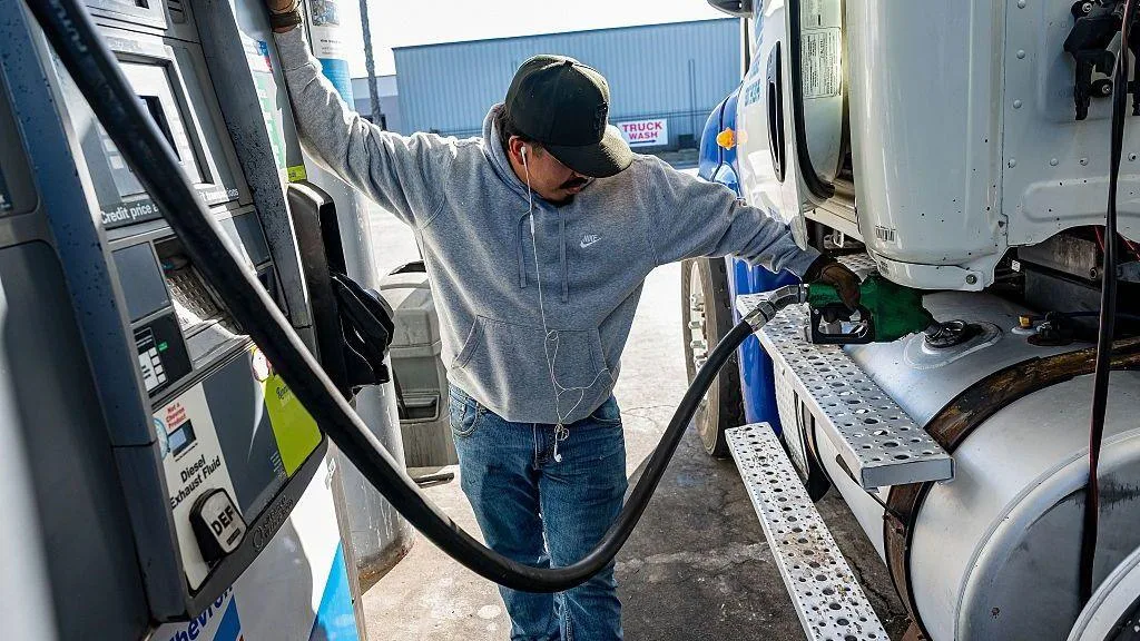 Fuel pumps and diesel price sign amid rising prices