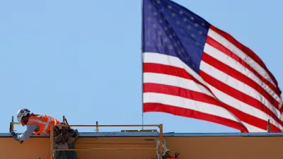 Workers on a city street as the U.S. jobs market slows