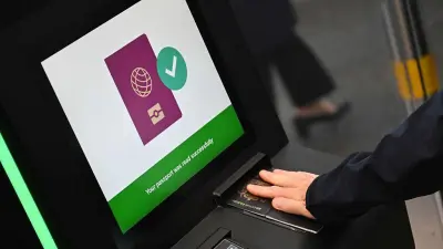 Passengers using passport-free e-gates at a UK airport