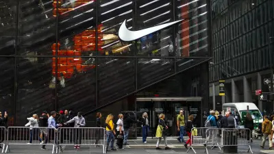 Nike logo and stock market chart